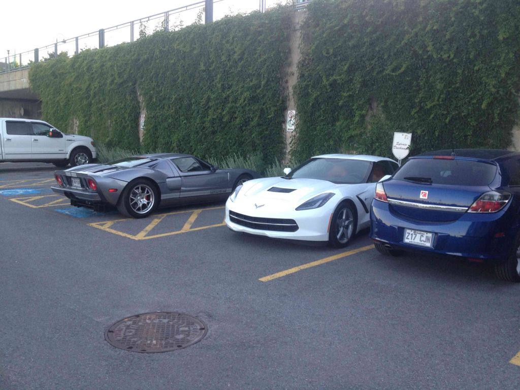 12-Some-Of-The-Cars-In-The-Marina-Lot -- 2014 Corvette and Circa 1970 Ford GT